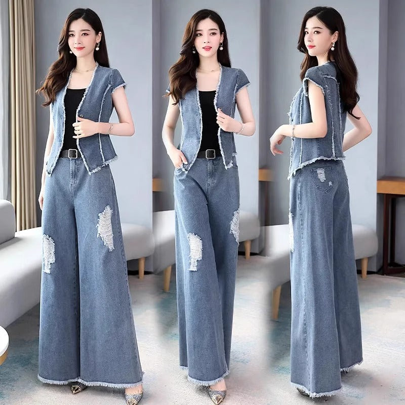 Woman wearing a denim outfit with a vest and wide-leg pants in a room setting.