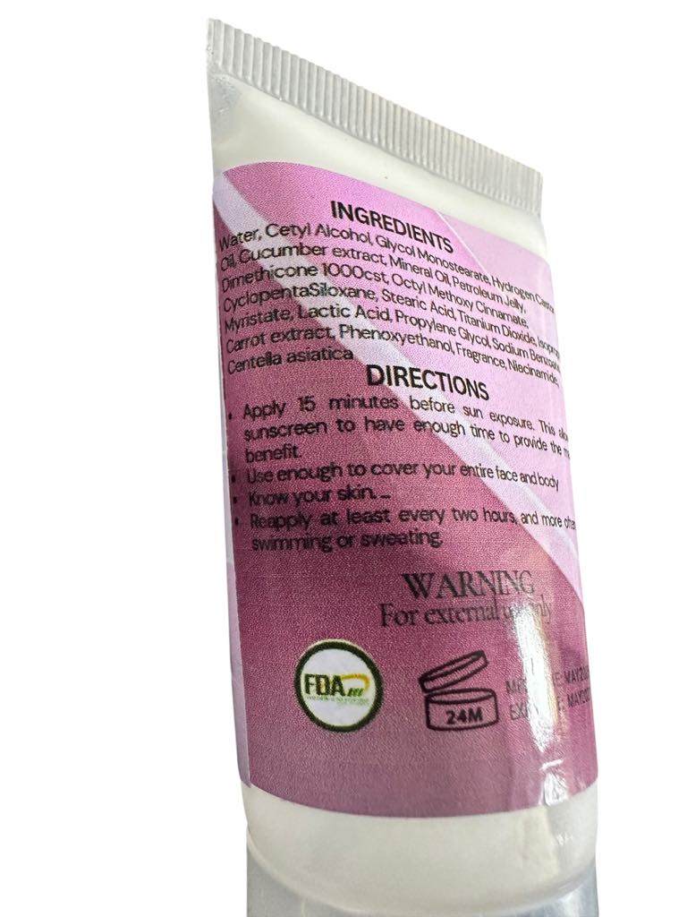 Sunscreen tube with pink label showing ingredients, directions, and FDA logo on a white background